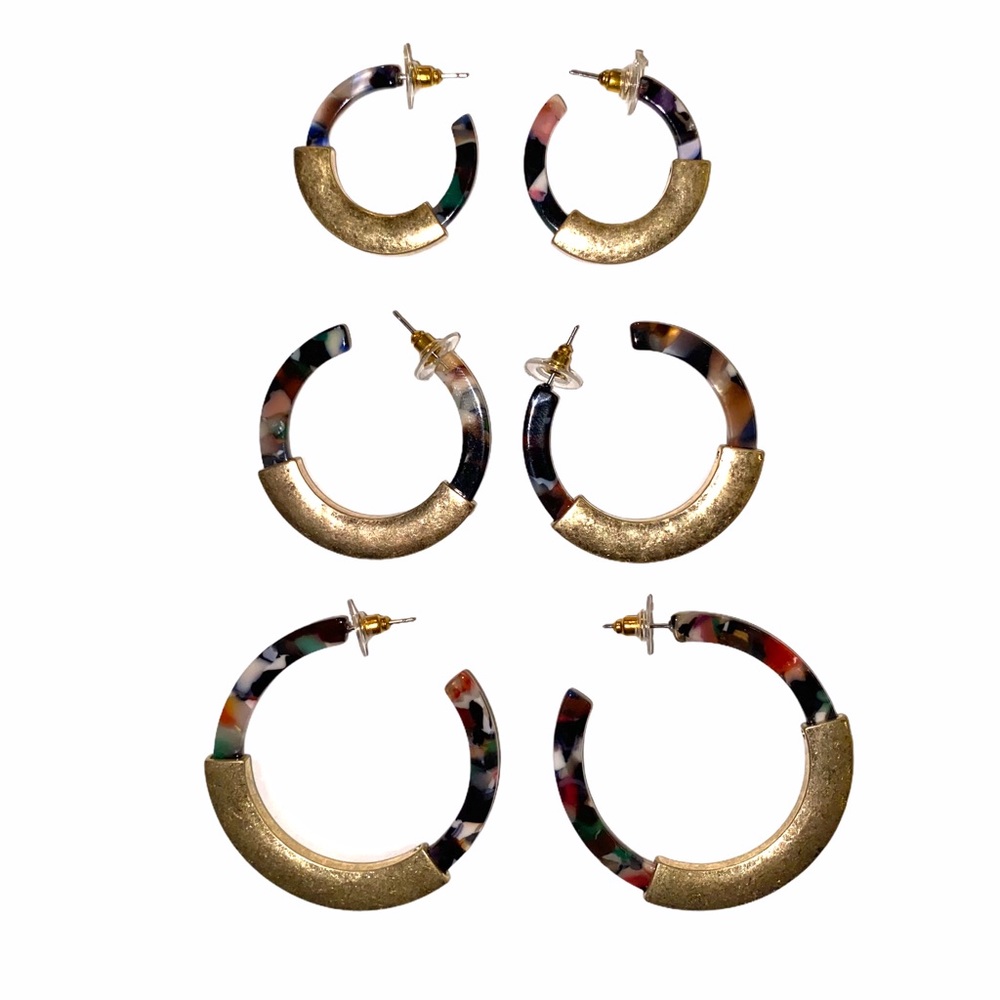 Acrylic multi colored gold accent hoop earrings.